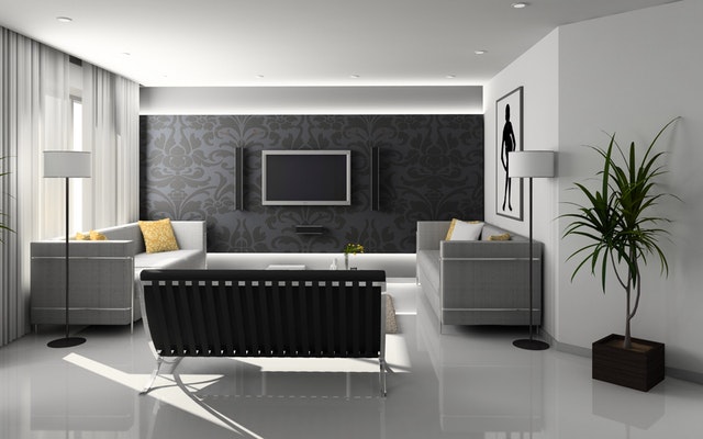 Obývacia izba ladená do čiernych a bielych farieb s veľkými presklennými dverami